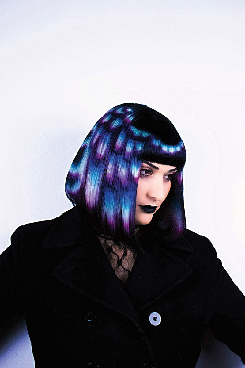 Person with a colorful bob wig on a white background